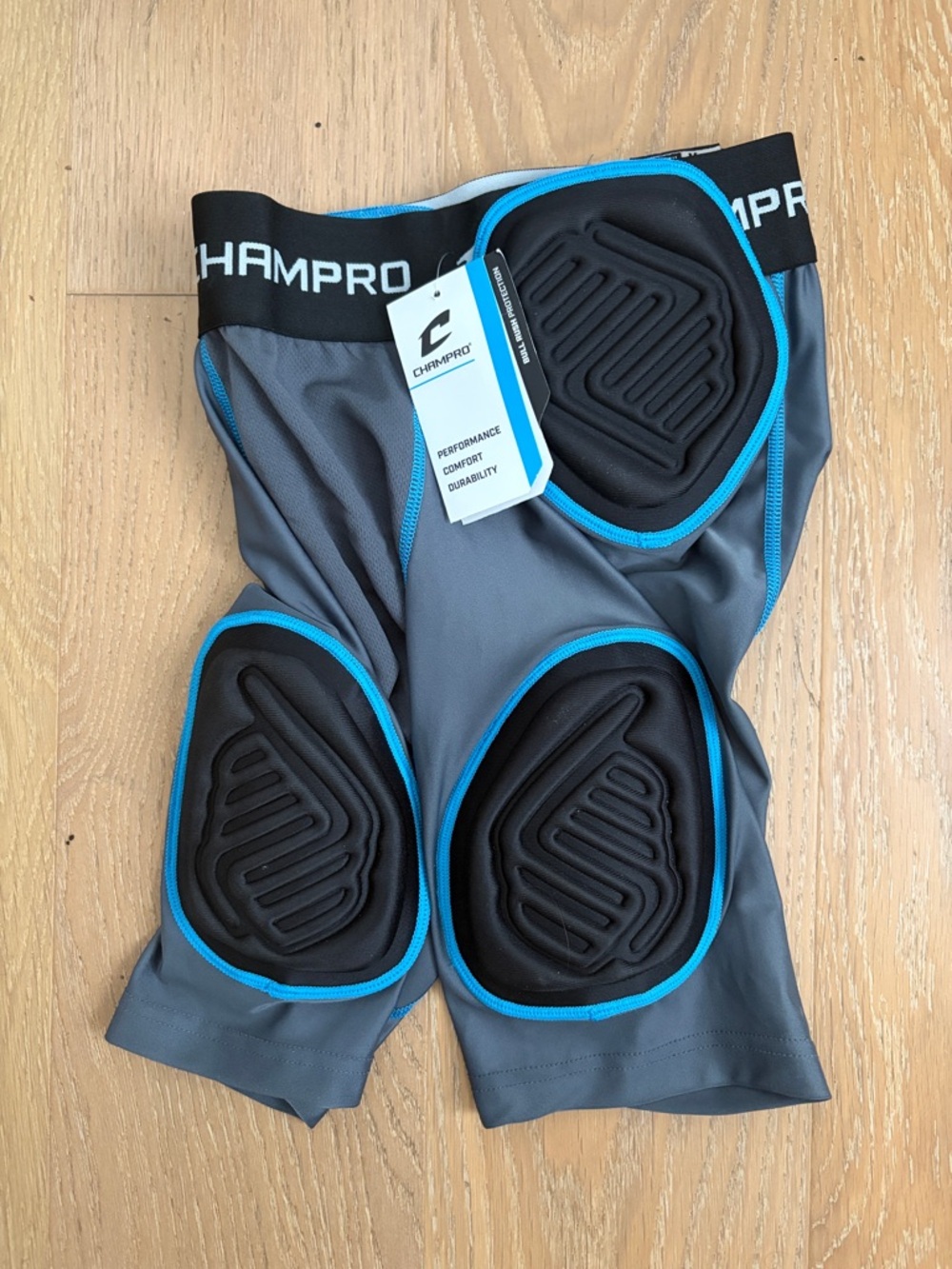 Champro Gray Compression football padded shorts with Blue Trim - youth medium